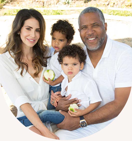 Robert F. Smith and Hope Dworaczyk Smith posing with two of their children
