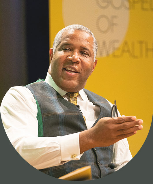 Community leader Robert F. Smith headshot speaking at an event