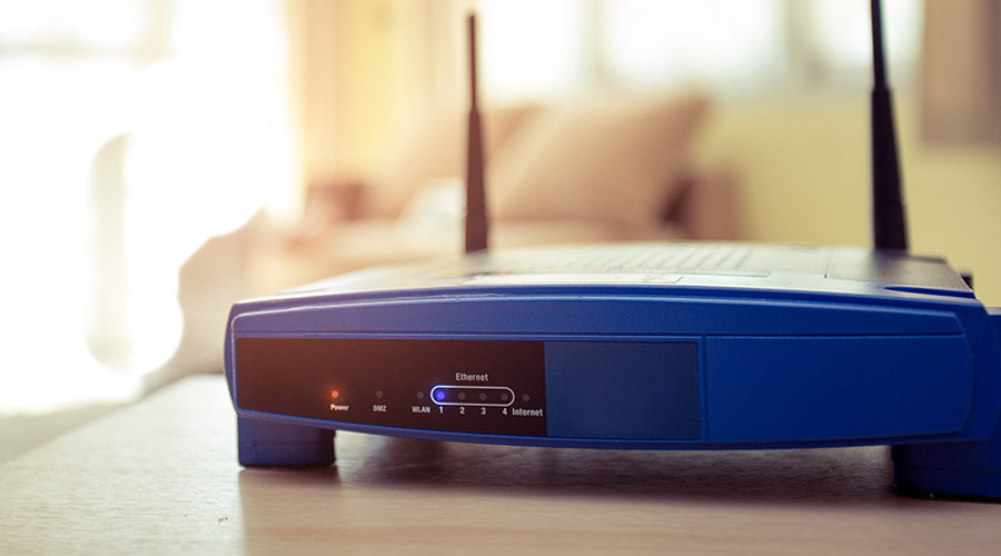 Image of a blue router sitting on a table