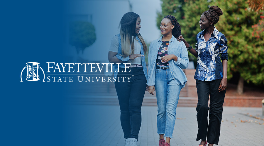 Three female HBCU students walking and chatting on campus with the Fayetteville State University logo on the left side