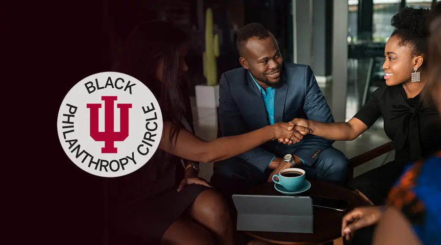 Three Black adults gather and shake hands, with a Black Philanthropy Circle at Indiana University graphic to the left