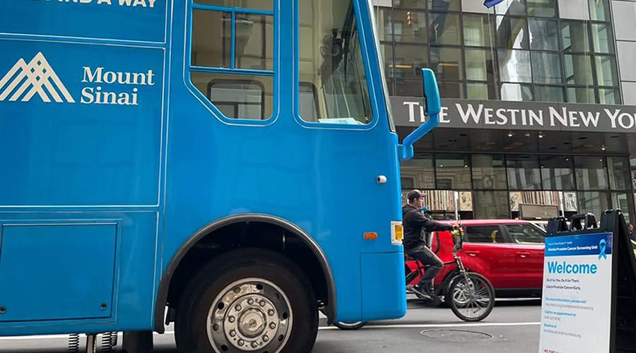 Blue Mount Sinai Robert F. Smith Mobile Prostate Cancer Screening Unit parked in front of the Westin New York Hotel