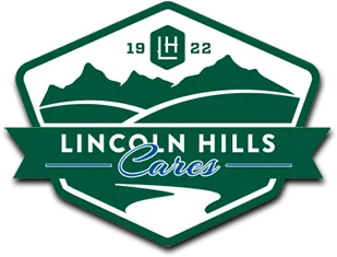 A patch-shaped design outlined in dark green, featuring a green outline of a mountainscape in the background. In the foreground, a green banner displays the text "Lincoln Hills Cares."