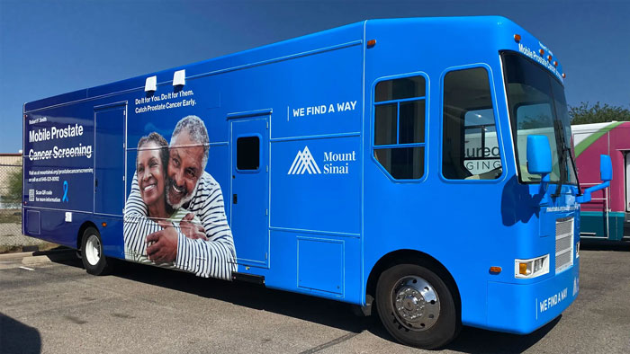 The Mount Sinai Robert F. Smith Mobile Prostate Cancer Screening Unit parked in a spot.